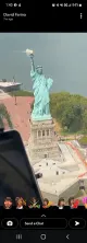 The image shows an aerial view of the Statue of Liberty situated on Liberty Island in New York Harbor.