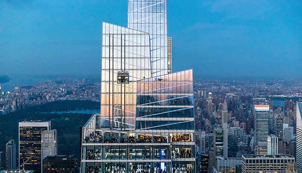 The image shows a modern glass-encased skyscraper with an observation deck overlooking a bustling cityscape during twilight