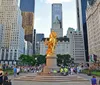 The image shows a vibrant city scene featuring the gilded statue of William Tecumseh Sherman at Grand Army Plaza with a bustling crowd and urban high-rises in the backdrop