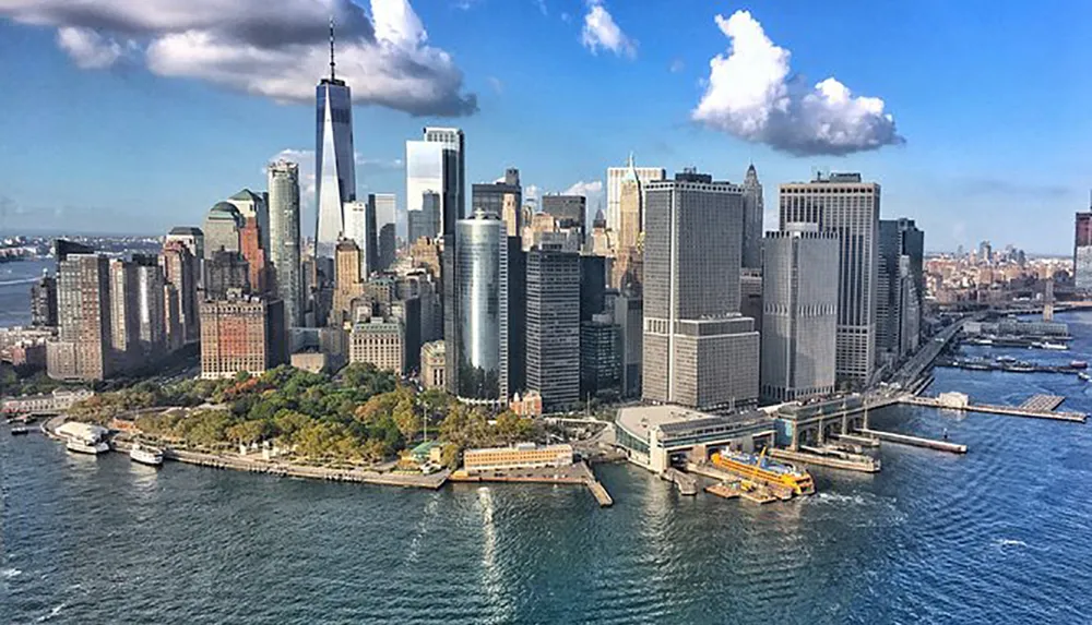 The image showcases an aerial view of a densely built section of Lower Manhattan with prominent skyscrapers and waterfront views
