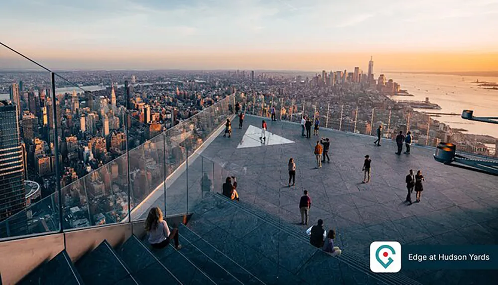 Visitors enjoy the panoramic view of the New York City skyline from the observation deck at Edge at Hudson Yards during sunset