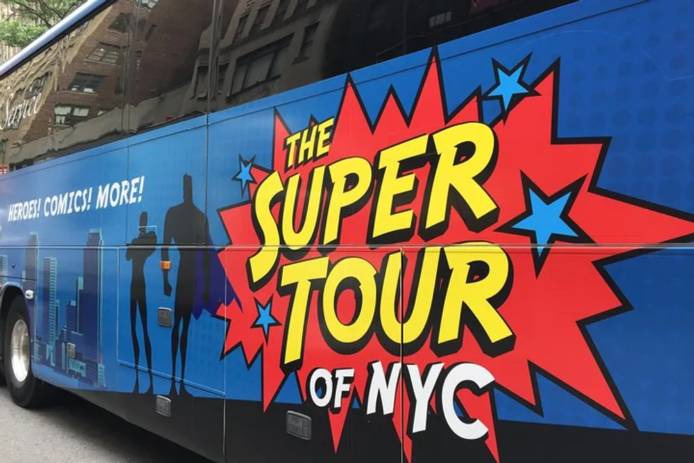 A tour bus with a vibrant comic book-style design that reads The Super Tour of NYC is promoting a themed tour experience likely focused on superhero landmarks or comic book history in New York City