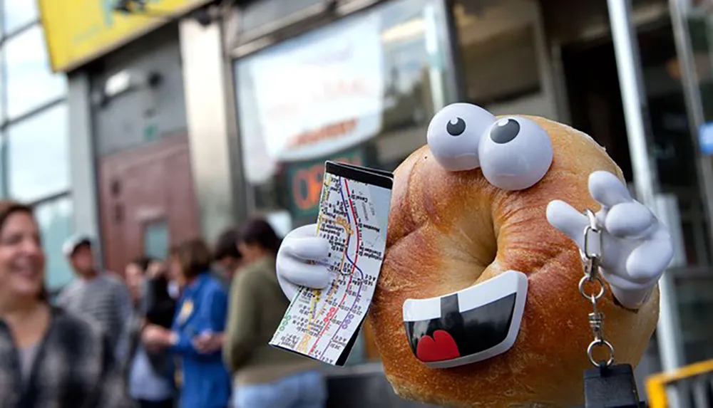 A personified bagel with eyes mouth and hands holds a map and appears to be a tourist creating a playful and whimsical scene on an urban street