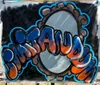 The image shows a colorful graffiti-style painting with the word OTAVIO sprayed in stylized letters on a backdrop that seems to be a mirror or reflective surfaceIf you need any more information or have other questions feel free to ask