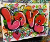 The image shows a colorful graffiti-style painting with the word OTAVIO sprayed in stylized letters on a backdrop that seems to be a mirror or reflective surfaceIf you need any more information or have other questions feel free to ask
