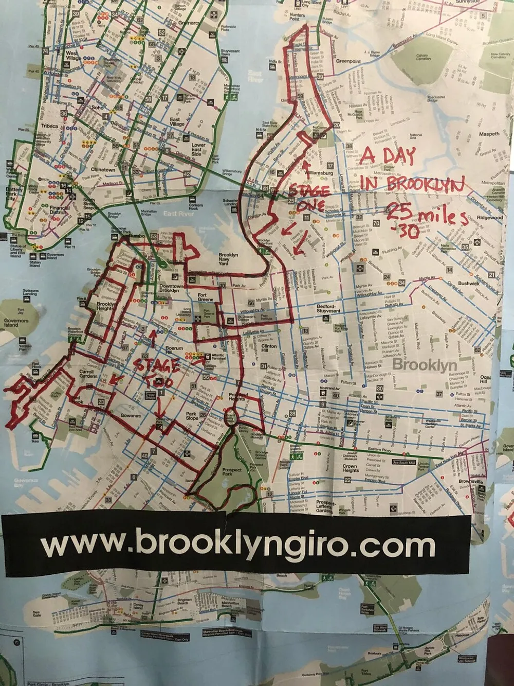 The image displays a map of a portion of New York City with a focus on Brooklyn showing annotated routes for STAGE ONE and STAGE TWO of a cycling or walking event and a title that reads A DAY IN BROOKLYN 25 miles - 30 miles along with the web address wwwbrooklyngirocom