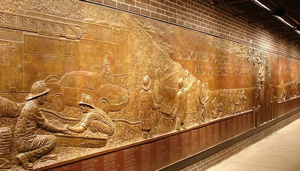 The image shows a large bronze relief mural dedicated to firefighters depicting various scenes of their courageous service