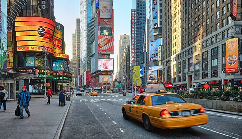 This is an image showing a bustling urban street scene with a yellow taxi in the foreground and illuminated billboards in the background which is indicative of Times Square in New York City