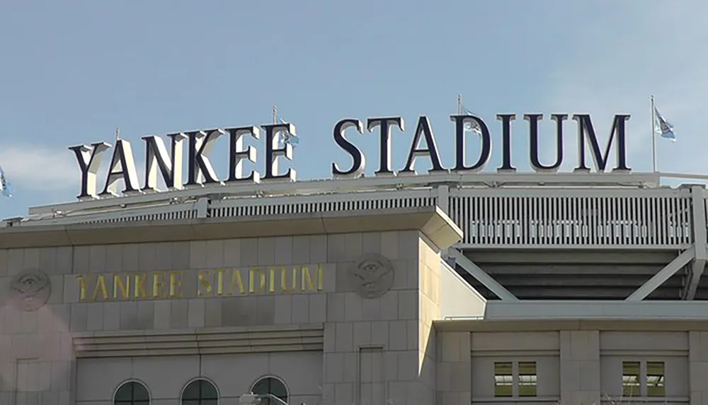 The image shows the large prominent sign of Yankee Stadium home of the New York Yankees baseball team on a clear day