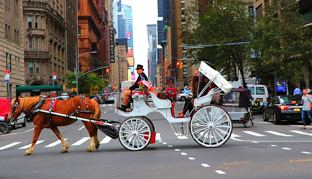 A horse-drawn carriage with a driver wearing a top hat travels along a bustling city street lined with tall buildings and traffic