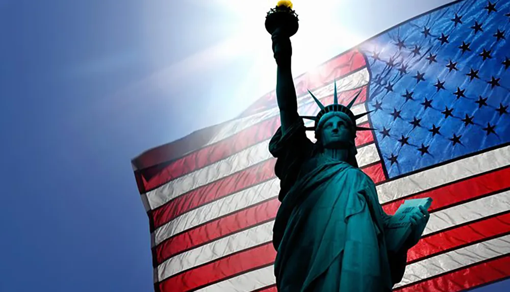 The image superimposes the silhouette of the Statue of Liberty in front of an American flag symbolizing the United States ideals of freedom and democracy