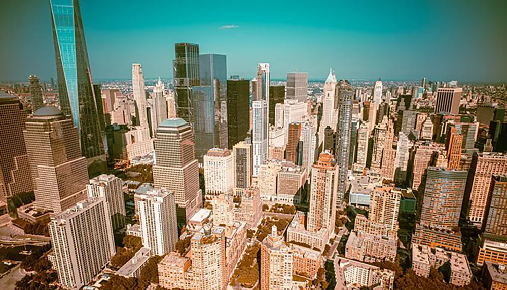 The image shows a bustling urban skyline with a mix of modern and traditional skyscrapers under a clear blue sky