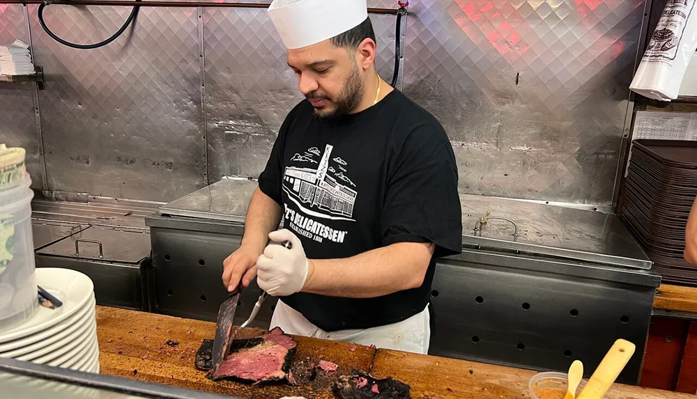 A chef is slicing a piece of medium-rare beef on a wooden cutting board at a delicatessens counter