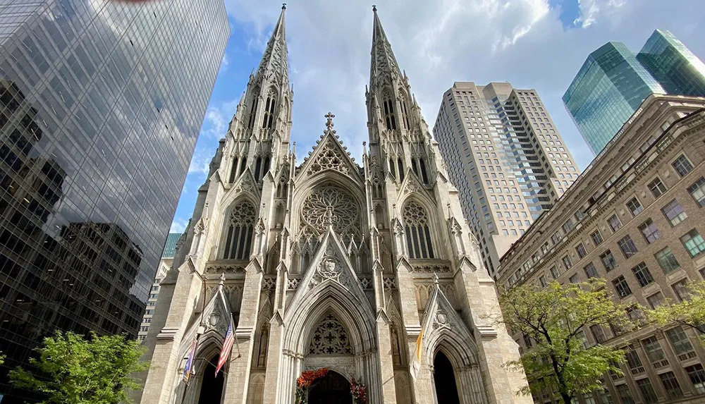 The image shows a Gothic-style cathedral juxtaposed with modern skyscrapers under a blue sky with clouds