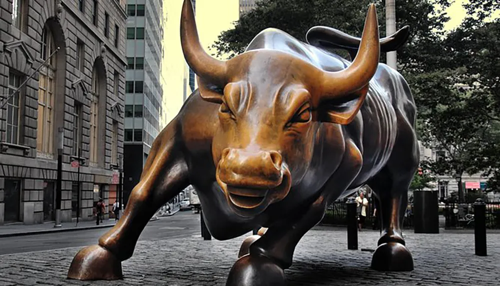 The image shows the iconic Charging Bull statue located in the Financial District of Manhattan New York City
