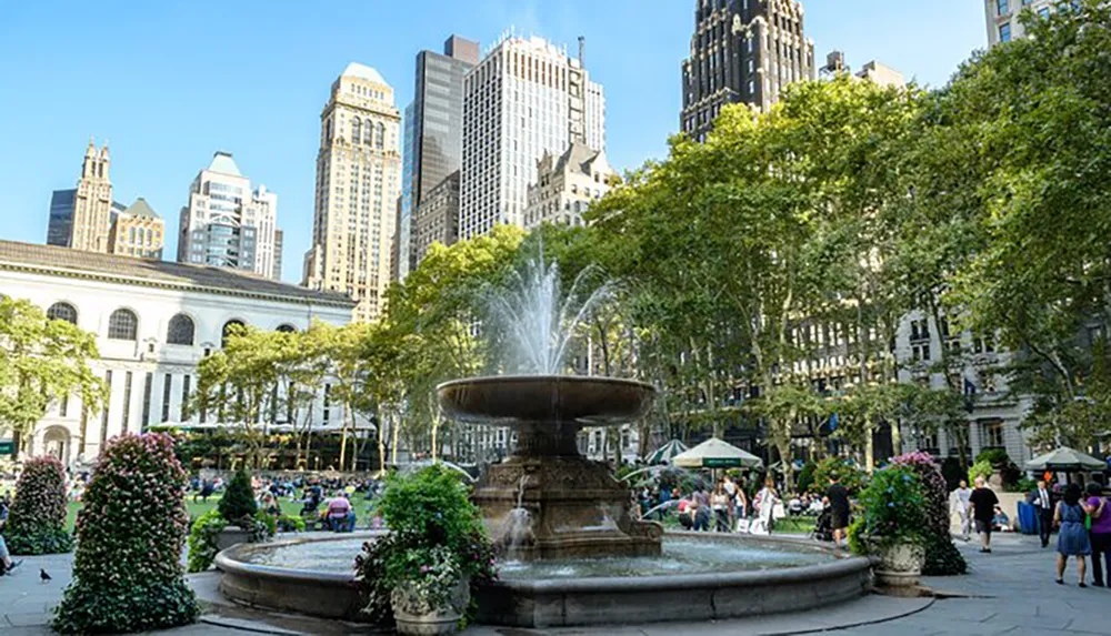 This image shows a bustling urban park with a fountain in the foreground surrounded by skyscrapers and lush greenery likely depicting a scene in a major citys public space